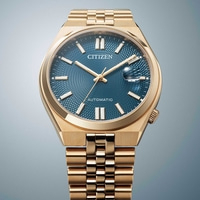 Kultainen Citizen-kello, jossa sininen kellotaulu ja automaattinen koneisto, tyylikäs muotoilu.