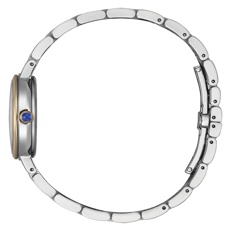 Hopeinen rannekello, jossa sininen jalokivi ja vihreä tausta sivusta katsottuna.