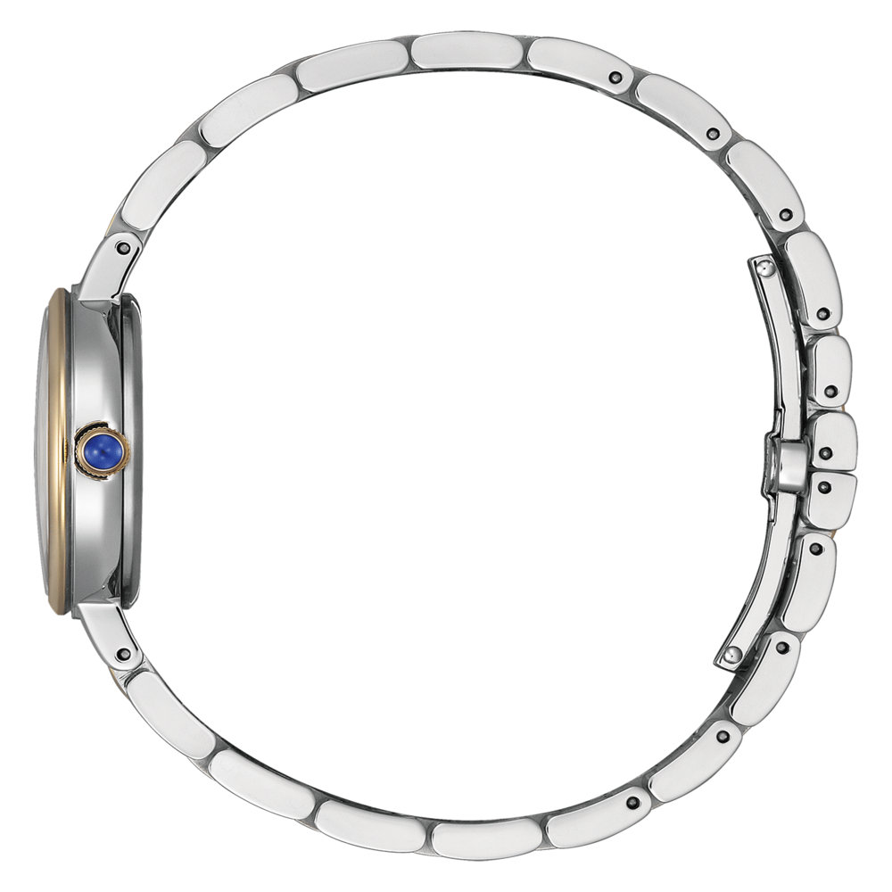 Hopeinen rannekello, jossa sininen jalokivi ja vihreä tausta sivusta katsottuna.