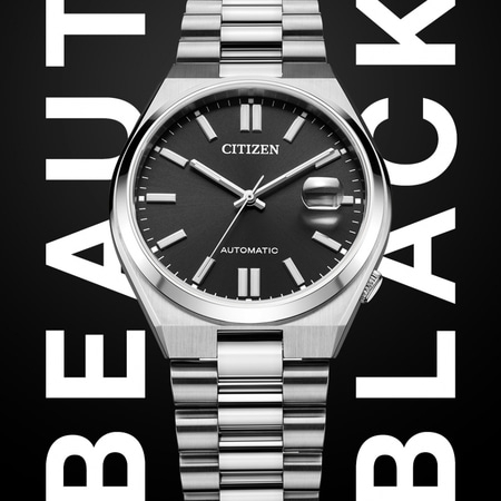 Citizen-kello, jossa musta kellotaulu, hopeinen ranneke ja sanat BEAUTY BLACK.